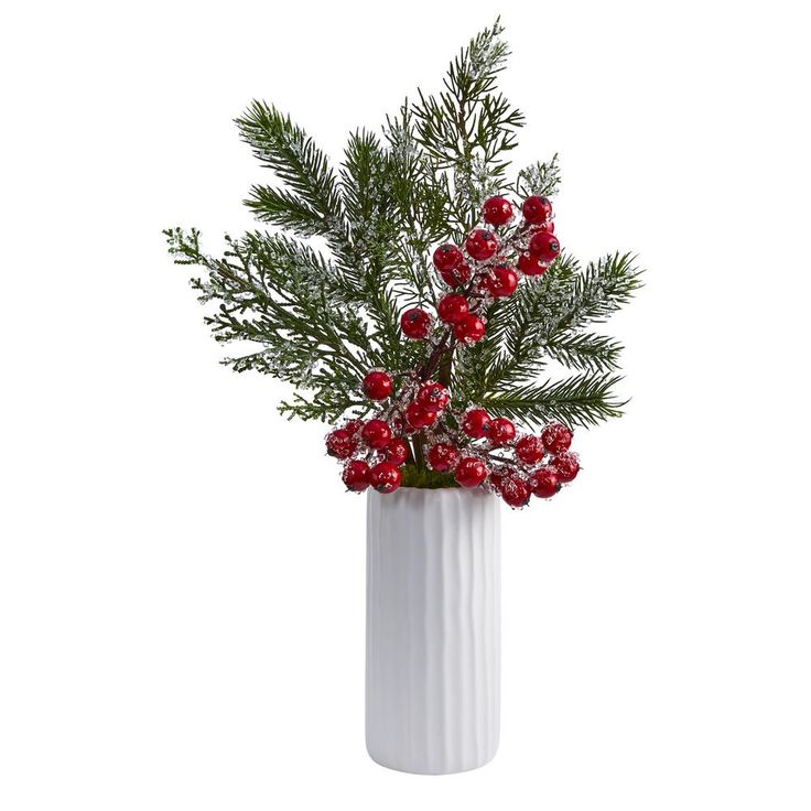 a white vase filled with red berries and greenery