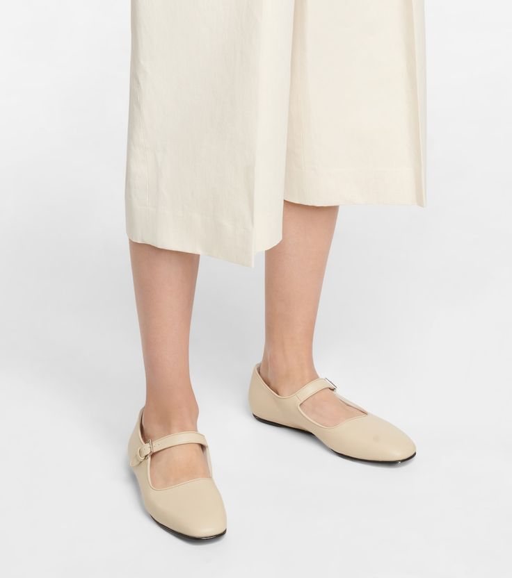 Ava Leather Ballet Flats in White - The Row | Mytheresa Classic Ballet Flats With Buckle Closure And Almond Toe, Classic Closed Toe Ballet Flats With Buckle, Almond Toe Ballet Flats With Buckle For Work, Classic Ballet Flats With Buckle Closure, Workwear Ballet Flats With Buckle Closure, Closed Toe Ballet Flats With Buckle For Work, Closed Toe Ballet Flats With Buckle Closure For Work, Classic Leather Ballet Flats With Ankle Strap, Classic Leather Ankle Strap Ballet Flats