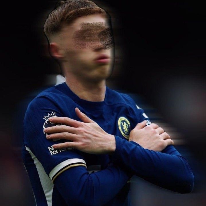 a soccer player with his arms crossed