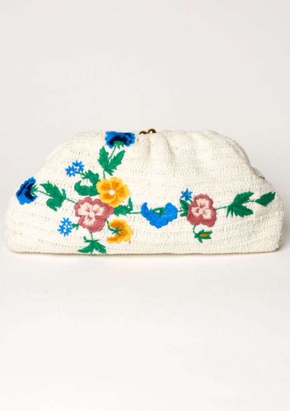 Add some floral flair to your summer wardrobe with the Vela Crochet Clutch. Perfect for beach days or nights out, this clutch features delicate embroidery and crochet details for a playful touch. Its optional gold chain allows for versatile styling options and the cotton stripe lining adds a pop of color. Don't miss out on this fun and functional accessory! Spring Chic Crochet Clutch Bag, Chic Spring Crochet Clutch Bag, Spring Woven Pouch Clutch, Summer White Pouch Clutch, White Pouch Clutch For Summer, Beige Woven Clutch For Spring, Spring Beige Woven Clutch, Beige Bohemian Clutch For Spring, Chic Cream Clutch For Spring