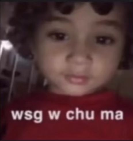 a young child wearing sunglasses and a red shirt with the words wsgw chu ma on it