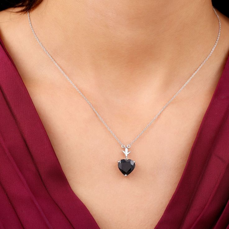 Product Details Bring out your gorgeous look wherever you go with this charming Minimal Solitaire Necklace. This beautiful Fine Necklace is embellished with the Heart Shape Black Spinel set in Prong Setting. A token of your eternal love, this Heart Necklace makes a perfect gift for your beloved, something she will always keep close to her heart. Product Information SKU SHP-PENDANT082019968 Length 18 mm Width 10 mm Height 7 mm Weight 2.86 gm (Approximate) BLACK SPINEL INFORMATION No.of Stones 1 P Black Diamond Heart-shaped Jewelry, Black Heart-shaped Diamond Jewelry, Black Diamond Jewelry For Valentine's Day, Black Gemstone Necklace For Wedding, Black Heart Cut Jewelry For Wedding, Black Fine Jewelry Necklaces For Wedding, Black Fine Jewelry Necklace For Wedding, Valentine's Day Black Diamond Jewelry, Formal Heart Pendant Jewelry In Cubic Zirconia