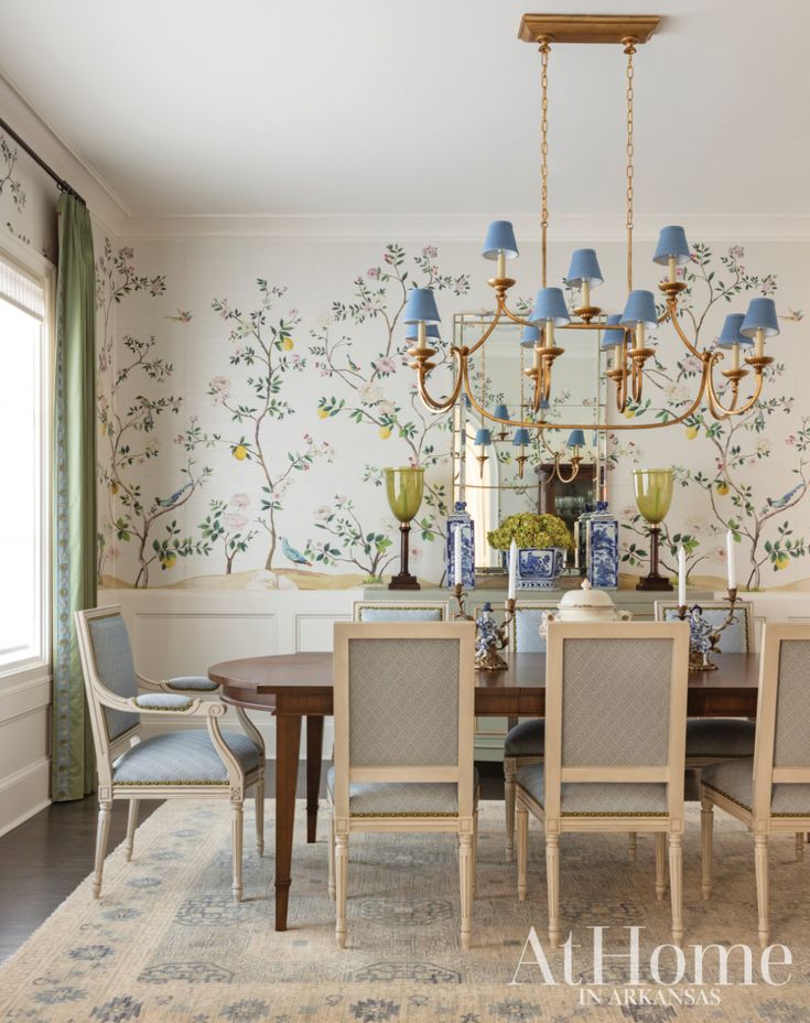 an elegant dining room with blue and white wallpaper