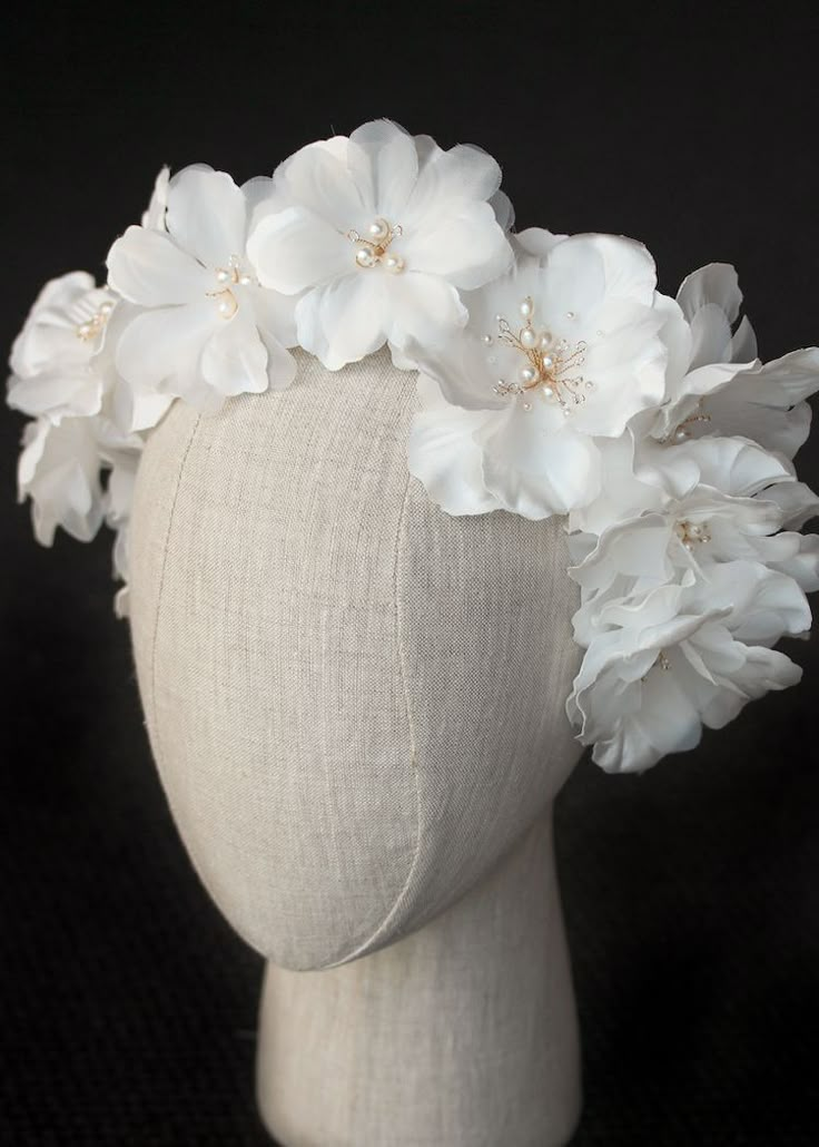 a white headpiece with flowers on it