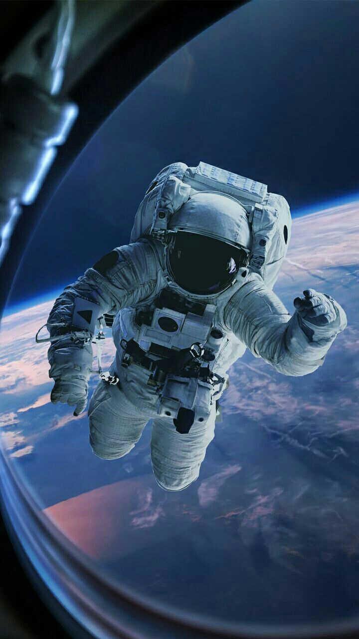 an astronaut floating in the air above earth