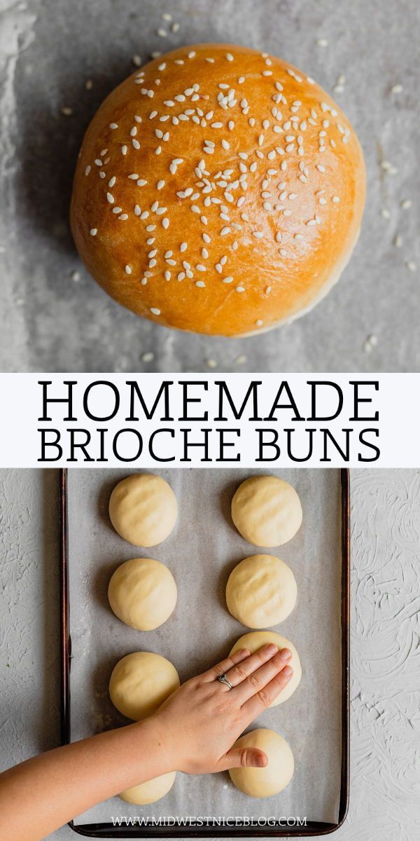 homemade brioche buns on a baking sheet with sesame seeds in the middle