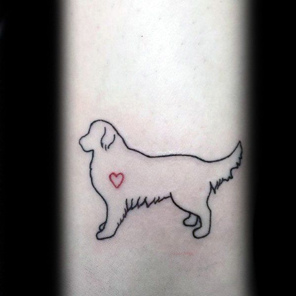 a dog with a heart tattoo on its leg