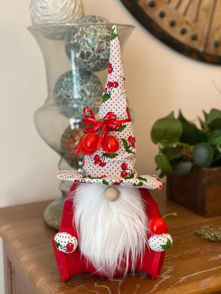 a gnome figurine sitting on top of a wooden table