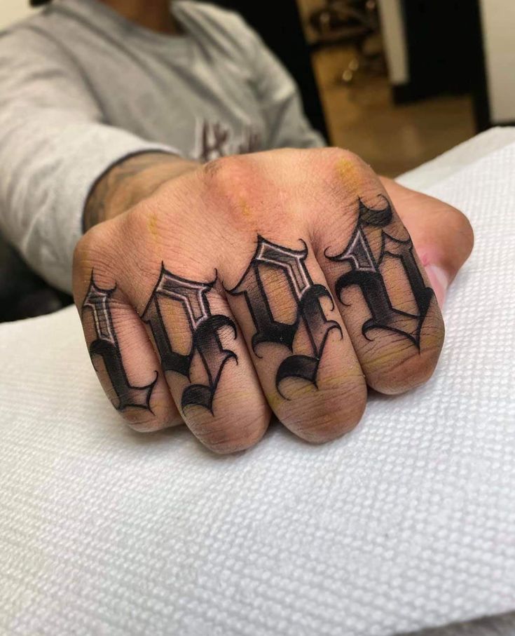 a person with a tattoo on their hand