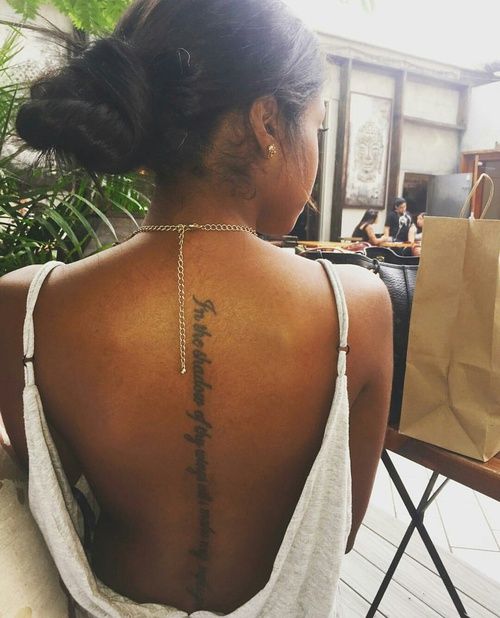 a woman with a tattoo on her back