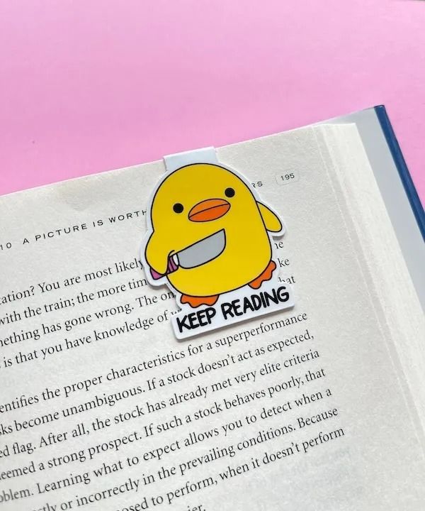 an open book with a sticker on it