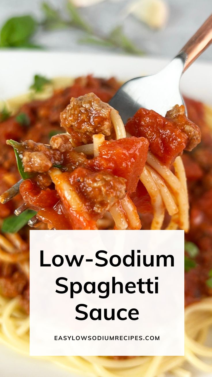 a fork full of spaghetti sauce with the words low - sodium spaghetti sauce above it