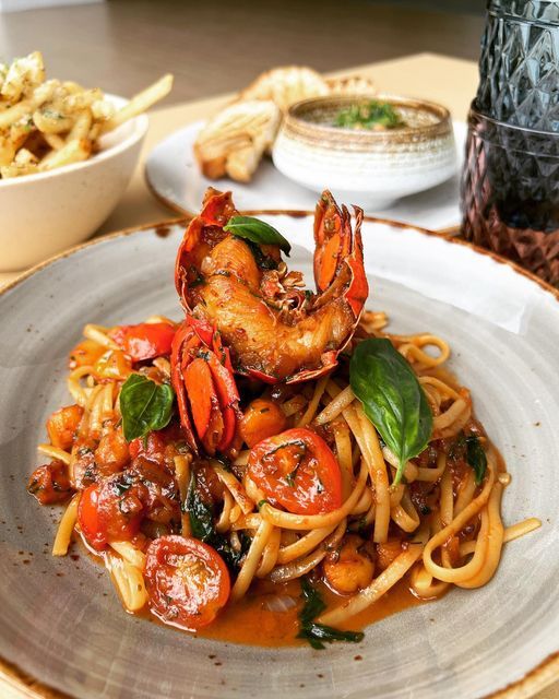 pasta with shrimp and tomato sauce on a plate