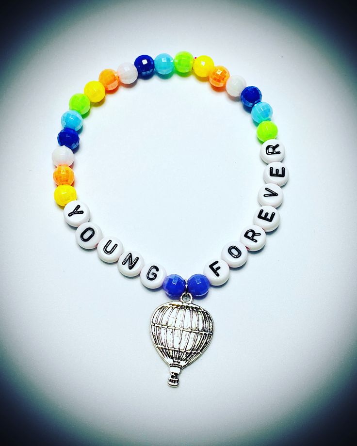 a beaded bracelet with a hot air balloon and the words young people written on it