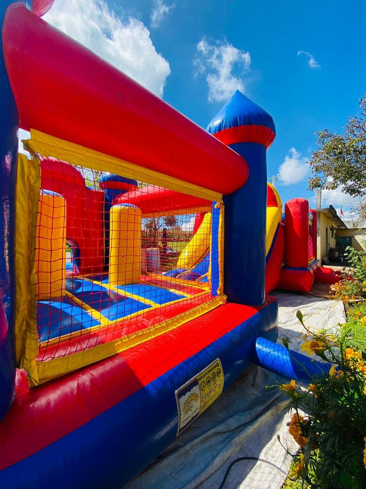 an inflatable bounce house is set up outside