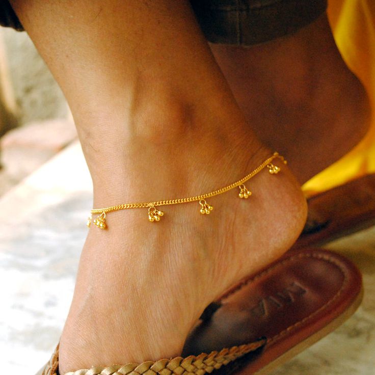 An Indian design with lovely shiny small gold beads/bells dangling in bunches of 3 on a dainty chain. Handcrafted with love and care, this is a very comfortable bracelet and a beautiful anklet. A perfect accessory for everyday wear. Lightweight and stylish..! * Gold Weight - 4.6 gms (length 7 inches) * Bracelet Length - 5 to 10 inches (Not including extra links) Find us on Instagram for exquisite designs: @abhikajewels Like us on Facebook: www.facebook.com/Abhikajewels Thank you for visiting our Gold Beads Bracelets For Festivals, Temple Jewelry Style Anklets As Gift, Traditional Wedding Anklets With Ankle Strap, Adjustable Traditional Anklets For Puja, Traditional Ankle Strap Wedding Anklets, Traditional Anklets For Puja, Adjustable Gold Anklets With Latkans, Gold Anklet For Wedding With Ankle Strap, Gold Anklet With Ankle Strap For Wedding