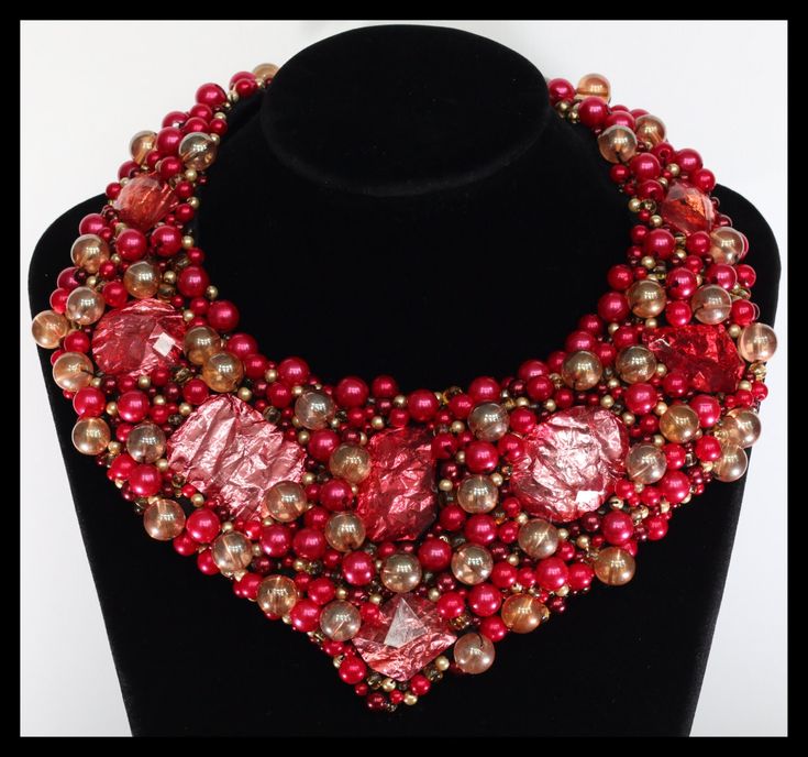 Sophisticated handmade necklace made of beads and unique decorations.  Locking with a bow (can be adjusted depending on the shape / depth ofneckline). Handmade Red Bib Necklace For Party, Red Beaded Necklace For Party, Elegant Red Bib Necklace For Party, Elegant Red Beaded Bib Necklace, Elegant Red Bib Necklace, Handmade Red Necklace For Evening, Red Faceted Beads Necklace For Party, Elegant Polished Beads Bib Necklace Gift, Elegant Bib Necklace With Polished Beads As Gift