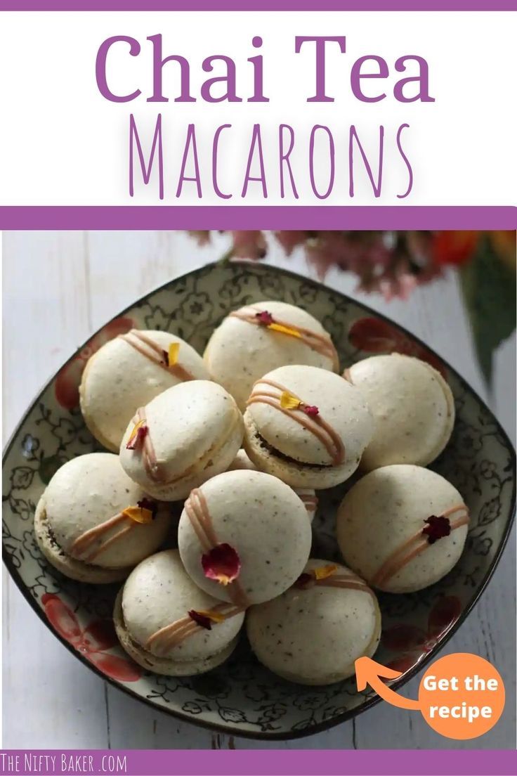 a plate filled with macarons sitting on top of a table