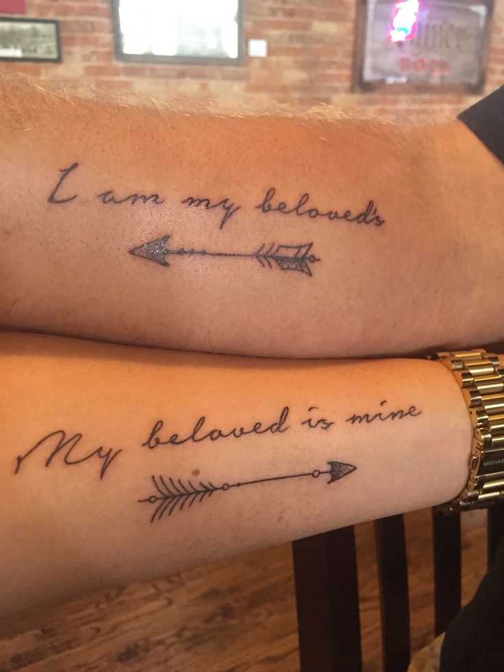 two people with tattoos on their arms that say i am my beloved and my beloved is mine