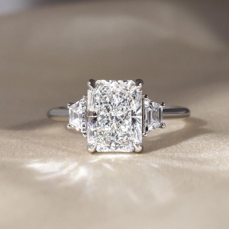 an engagement ring with three stone diamonds