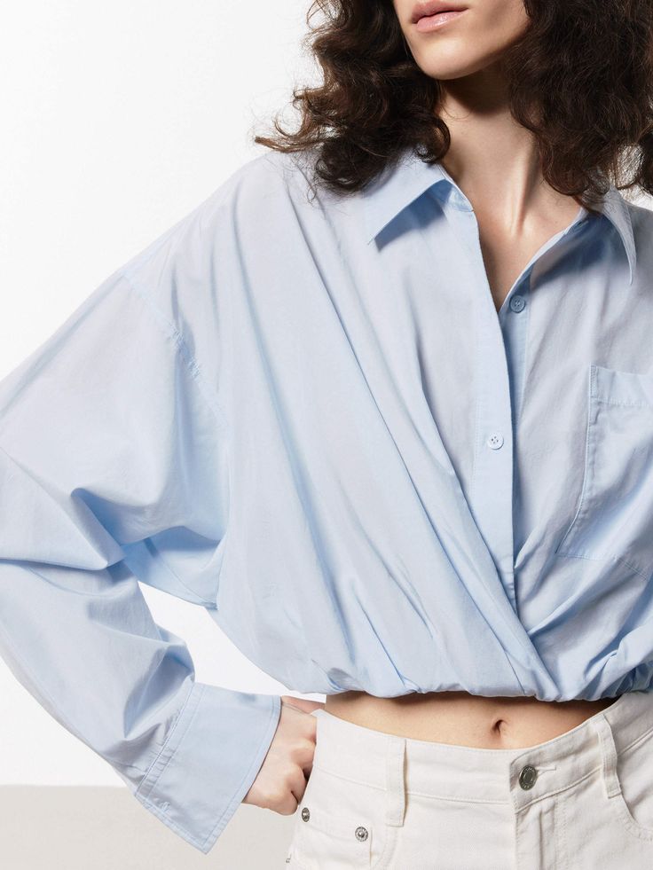 MO&Co. Women's Cotton Silk Cropped Shirt Offered in a soft blue and white hue, this shirt is made with a comfortable blend of cotton and silk. It's shaped in a cropped silhouette and stretchy hem for a stylish yet comfortable fit. Perfectly pairs with high-waisted shorts or pants. Features : - Regular fit, cropped- Elasticised hem, pointed collar- Soft touch, made from cotton and silk Code: MBD2SHTT53The back length of size S is 52cmMATERIALS & CARE Material: 59.1% Cotton 40.9% SilkREMINDER: All Chic Cropped Cotton Shirt, Chic Long Sleeve Cotton Cropped Shirt, Oversized Collared Light Blue Top, Oversized Light Blue Collared Top, Relaxed Fit Long Sleeve Cropped Shirt For Spring, Blue Blouse With Shirttail Hem For Daywear, Relaxed Fit Long Sleeve Cotton Cropped Shirt, Blue Shirt With Shirttail Hem For Spring, Light Blue Long Sleeve Tops For Daywear