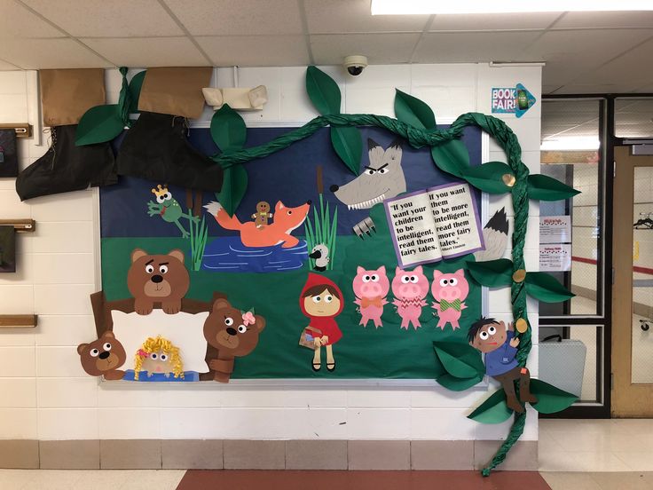 a bulletin board with animals and plants on it in a school hallway or classroom room