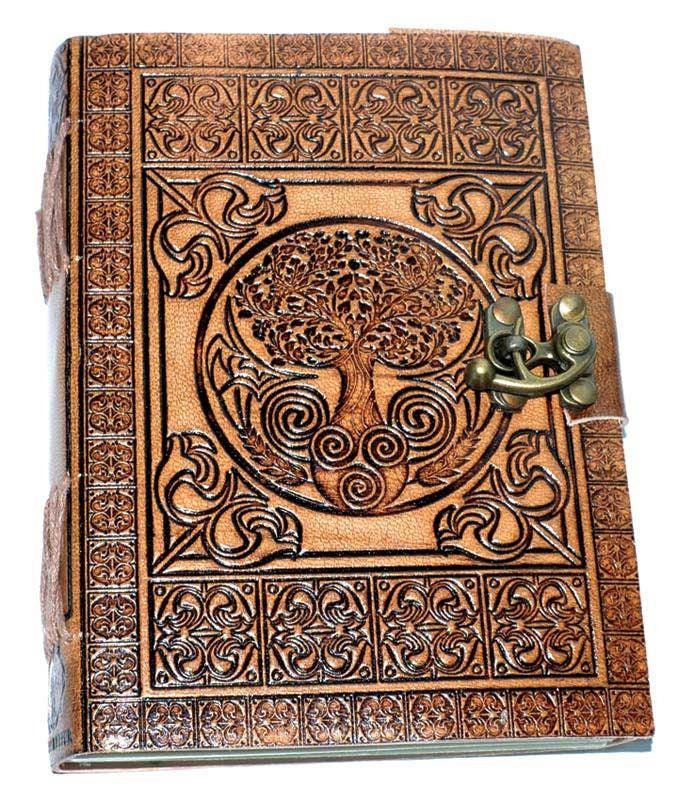 Introducing the Tree of Life Leather Journal: Embrace the Eternal Connection of Celtic Wisdom Step into a world of ancient wisdom and mystical symbolism with our Tree of Life Leather Journal, meticulously hand-tooled and embossed with the Tree of Life and intricate Celtic Knotwork. The border embossing adds a touch of uniqueness to each journal, making it a one-of-a-kind piece. The size of the journal may vary slightly, adding to its individual character. Crafted from genuine soft and supple designer dark brown leather, this journal carries the alluring scent of real leather and is naturally tanned with a special oil, creating a keepsake that will hold your thoughts, plans, and ideas in its embrace. The Tree of Life, a symbol of eternal connection and growth, stands as a testament to the c Diy Grimoire Cover, Leather Journal Ideas, Grimoire Cover, Japanese Dragon Art, Diy Grimoire, Knotwork Border, Blank Book Of Shadows, Tree Of Life Celtic, Celtic Knotwork Design