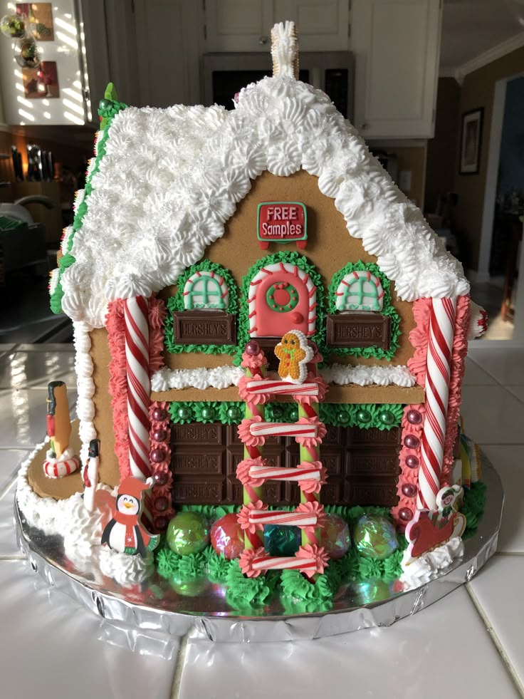 a large gingerbread house decorated with icing and candy