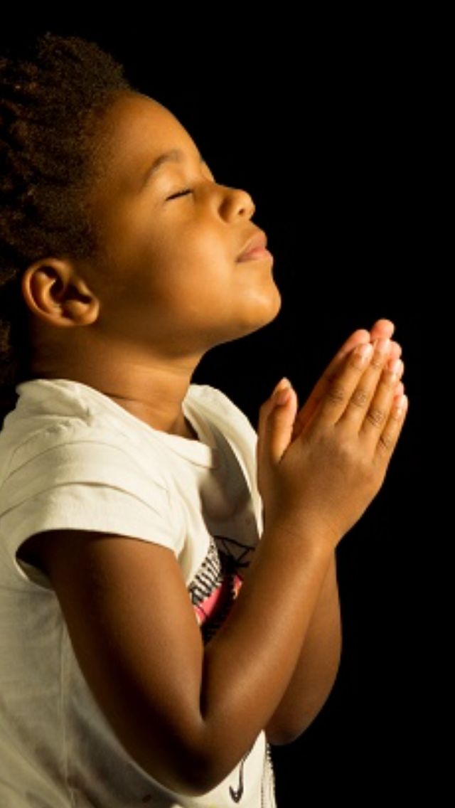 a young boy is praying with the words prayer for intercession on his chest