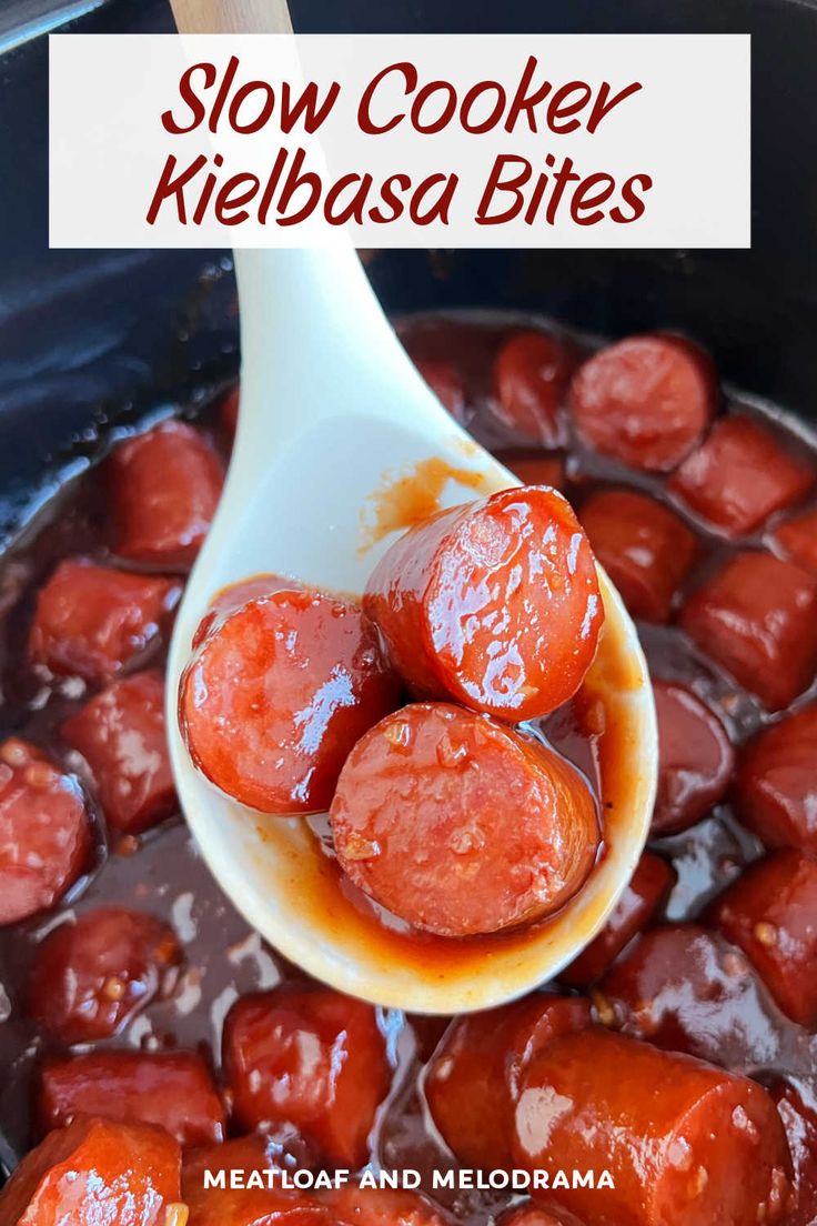 slow cooker kielbasa bites recipe in a crock pot with wooden spoon