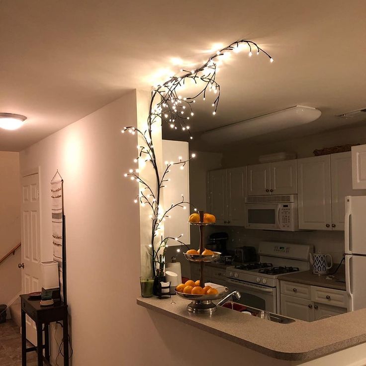 the kitchen is decorated with lights and decorations