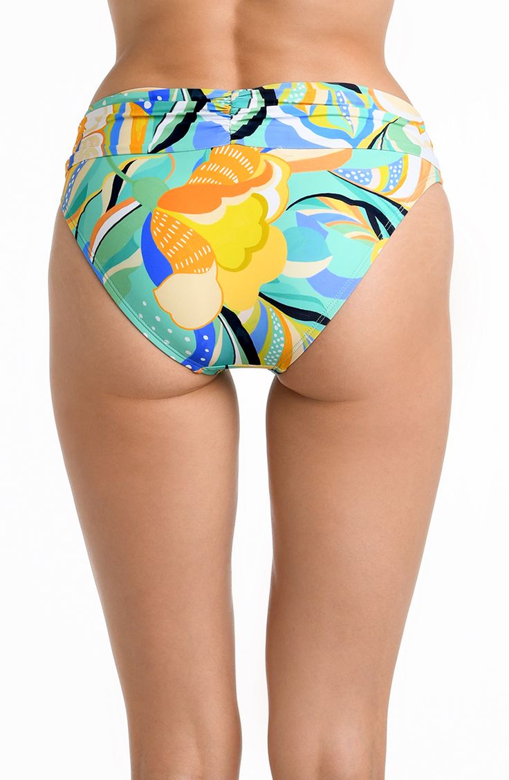 Radiate tropical energy with this vibrant marigold bottom adorned in a multi-colored tropical print, infusing your beach look with a burst of vivid hues reminiscent of sun-drenched paradises. These hipsters instantly smooth and slim with an eye-catching fold-over band that provides a comfortable fit. The hipster cut flatters your figure in front with discreet coverage in back that won't take away from your curves. [split] Details Hipster Bottom Fold-Over Waistband Moderate Rear Coverage Fabric 8 Hawaiian Style Bottoms For Beach Party In Spring, Vibrant Green Swimwear For Sunbathing, Multicolor Beachy Bottoms For Vacation, Beachy Multicolor Bottoms For Vacation, Green Floral Print Pool Bottoms, Tropical Green Printed Swimwear, Green Tropical Printed Swimwear, Green Floral Print Bottoms For Pool, Multicolor Beachwear Bottoms For Vacation