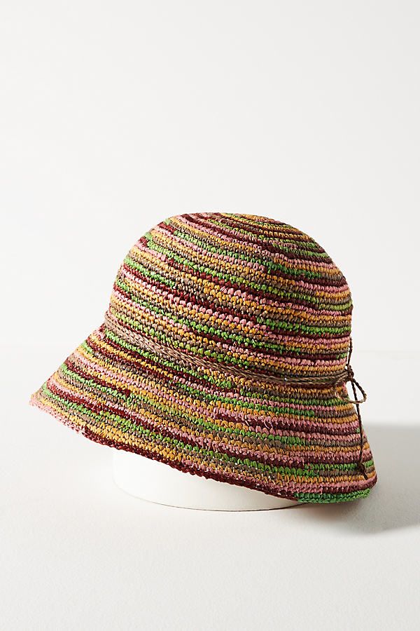 a multicolored hat sitting on top of a white table