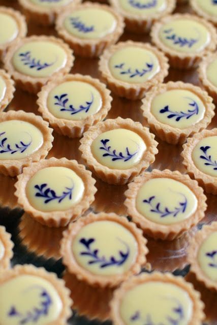 small blue and white desserts sitting on top of a table