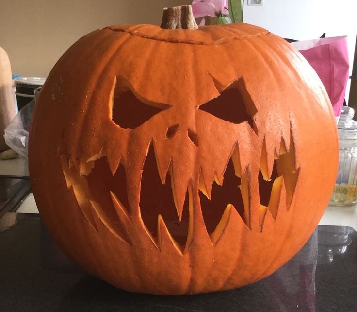 a carved pumpkin sitting on top of a table