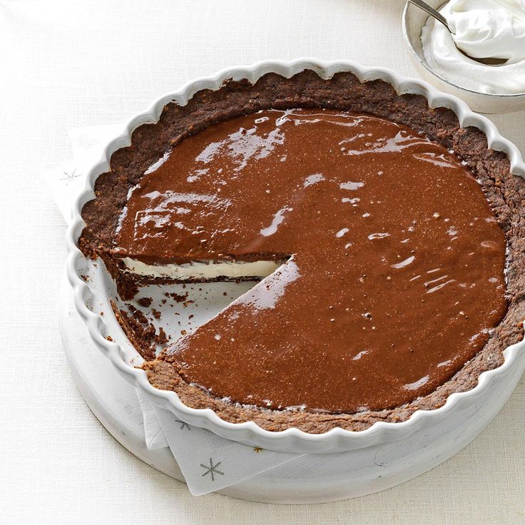 a chocolate pie sitting on top of a white table