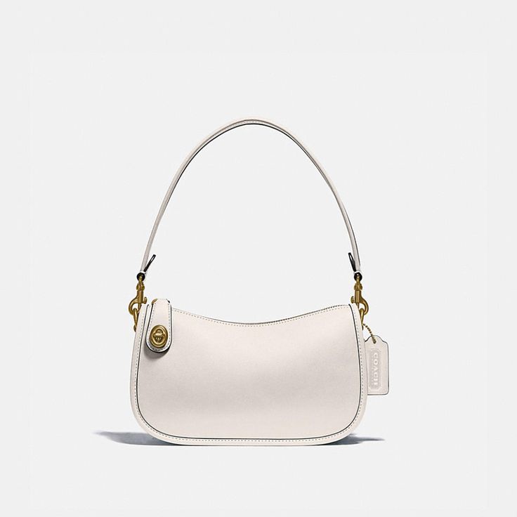 The Swinger Bag is part of The Coach Originals, a collection of archival-inspired bags that celebrates our legacy and authentic New York heritage. This streamlined glovetanned leather style is based on a 1980s Coach design reimagined for today. Featuring our iconic turnlock closure, the zip-top short-strap shoulder bag sits just beneath the underarm for hands-free convenience and includes a detachable strap to wear crossbody. Some styles are just too good to leave in the archives. Classic Top Handle Baguette Bag, Classic Handheld Baguette Bag With Adjustable Strap, Classic Handheld Baguette Bag For Formal Occasions, Classic White Baguette Bag, Classic White Baguette Bag For Evening, Coach Swinger Bag, Coach Store, Monogrammed Items, Leather Style