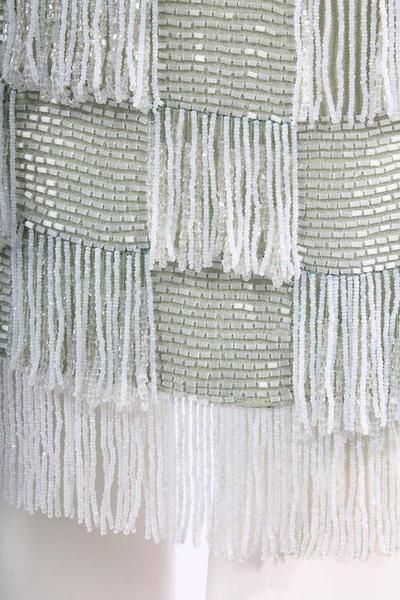 a curtain with fringes hanging from it's side