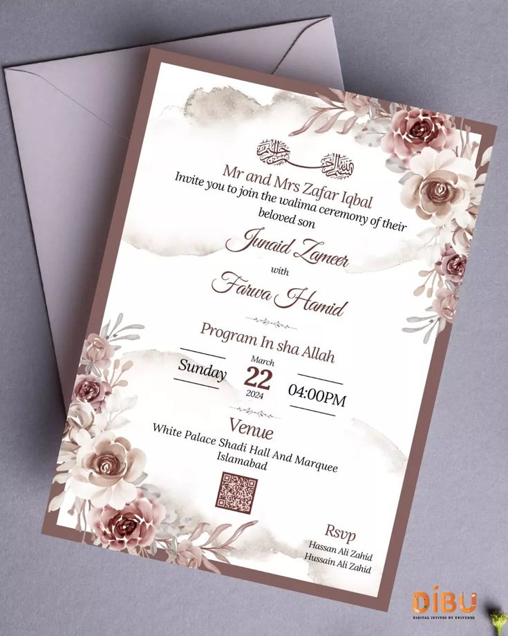 an elegant wedding card with flowers on it