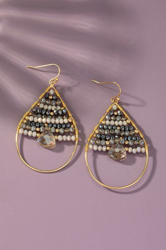 Make a statement with these funky Faceted Glass Beaded Teardrop Earrings! The wire-wrapped beads add a touch of whimsy to the classic teardrop shape, while the fishhook earwires make them easy and comfortable to wear. Perfect for any fashion-forward individual looking to add a fun pop of color to their outfit. size: 2.5"ships from USA Teardrop Beaded Earrings With Ear Wire For Party, Beaded Teardrop Hoop Earrings For Party, Teardrop Beaded Earrings For Party, Party Teardrop Beaded Earrings With Ear Wire, Party Teardrop Beaded Earrings, Bohemian Beaded Teardrop Earrings For Party, Party Teardrop Beaded Metal Earrings, Bohemian Dangle Teardrop Earrings With Faceted Beads, Bohemian Teardrop Wire Wrapped Earrings