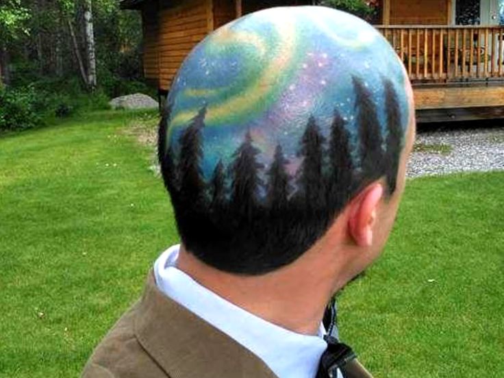 a man with his hair painted to look like the stars in the sky and trees