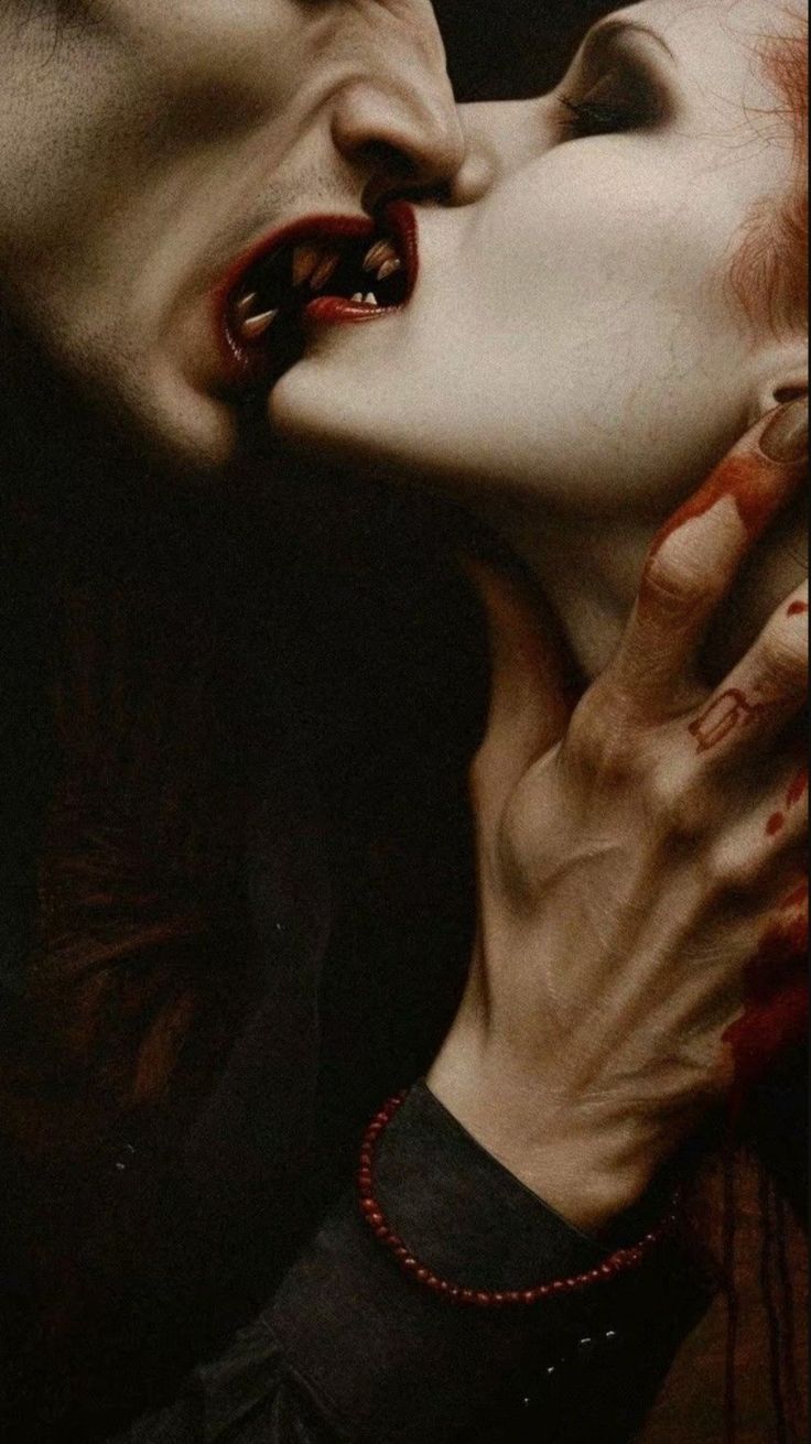 a woman with blood on her face is kissing a man's face in the dark