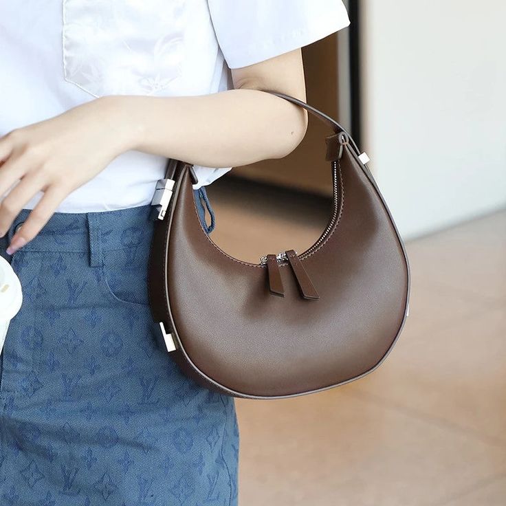 Discover Elegance and Versatility Step into a world of style and sophistication with our Elegant Leather Moon-Shaped Shoulder Bag, designed exclusively for the chic, modern woman. Crafted from high-quality split leather with a sleek polyester lining, this bag showcases a unique half-moon silhouette that is both eye-catching and functional. Whether you're heading to a casual brunch or an elegant evening event, this versatile accessory is your perfect companion. Product Features Type: Shoulder & Handbags Main Material: Split Leather Lining Material: Polyester Shape: Half Moon Hardness: Soft Pattern: Solid Closure Type: Zipper Style: Fashion Benefits of Your New Favorite Bag Versatile Use: Suitable for various occasions, from daily errands to special events. Organized Storage: Features an int Moon Place, Moon Silhouette, Beauty Equipment, Bag Icon, Moon Design, Mens Shoes Boots, Types Of Bag, Luxury Women, The Chic