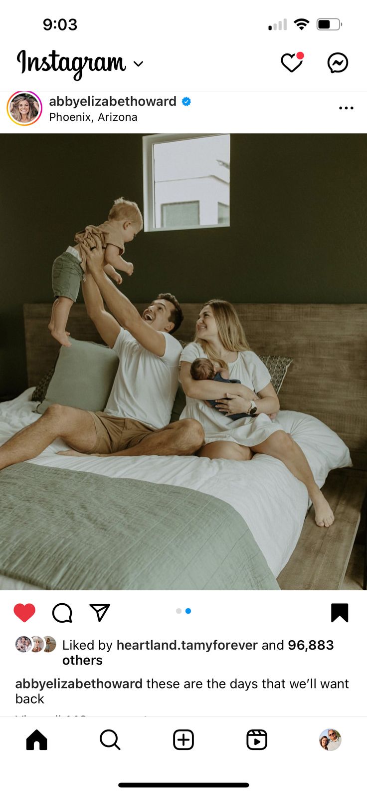 an instagram page with two men and one woman on the bed holding their babies