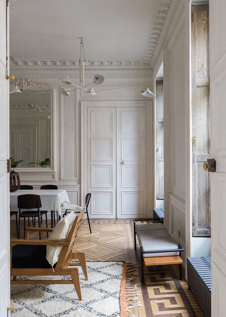 a living room filled with furniture and white walls