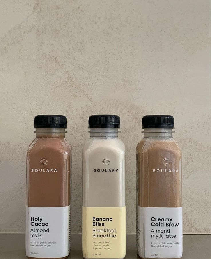 three different types of smoothies on a counter