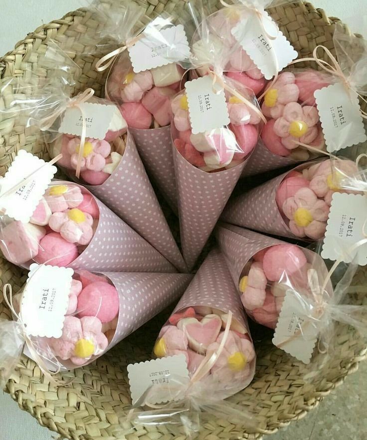 a basket filled with pink and yellow marshmallows