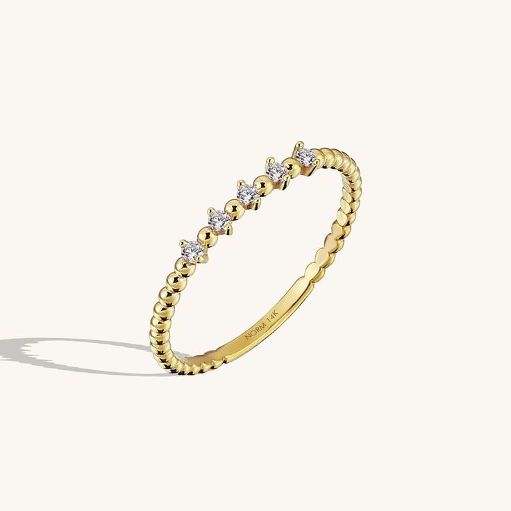 The Mini Ball Ring’s design has become a masterpiece of elegancy with its unique style. Its glittering stones become completely more beautiful when they meet the splendor of gold. The Mini Ball Ring, generously demonstrate its eye-catching glow by its sparkling stones, will look much more beautiful in your slender hands. - Made in 14k solid gold, - Decorated with handset london blue cubic zirconia stone on 14k solid gold - Band Width: 1.52 mm / 0.059 inches - Thickness: 1.50 mm / 0.05 inches -Th Luxury Sparkling Rings For Party, Luxury Sparkling Party Rings, Gold Sparkling Crystal Ring, Classic Gold Sparkling Rings, Formal Crystal Ring With Sparkling Stones, Fine Jewelry Sparkling Diamond Stackable Rings, Fine Jewelry Diamond Stackable Rings With Sparkling Detail, Elegant Gold Stackable Diamond Ring, Dazzling 14k Gold Stackable Rings