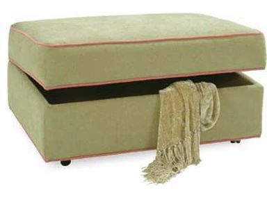 an ottoman with a blanket on it