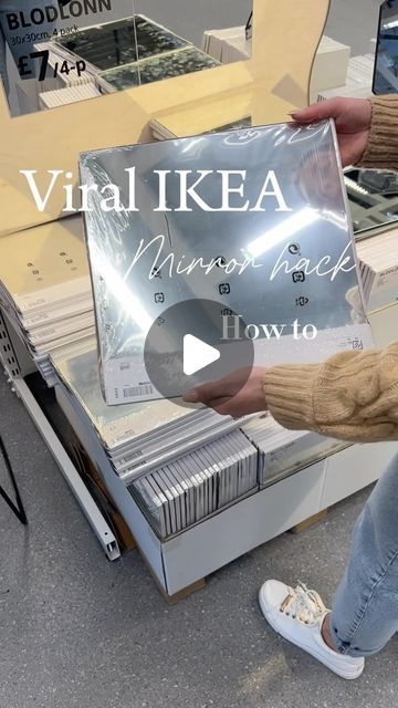 a woman is holding up a sign in front of a store window that says virtual ikea